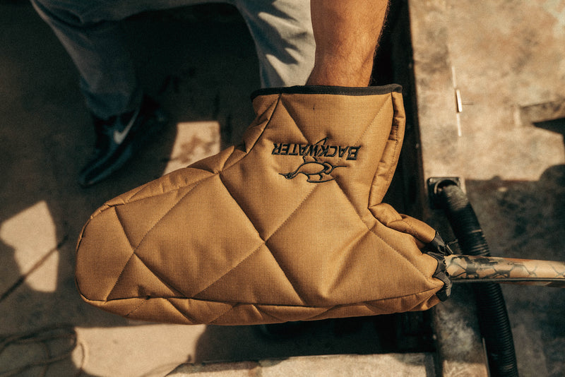 Hand in the mitt on a Mud Buddy tiller handle
